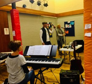 Image of band members practising in the Youth Centre Hall